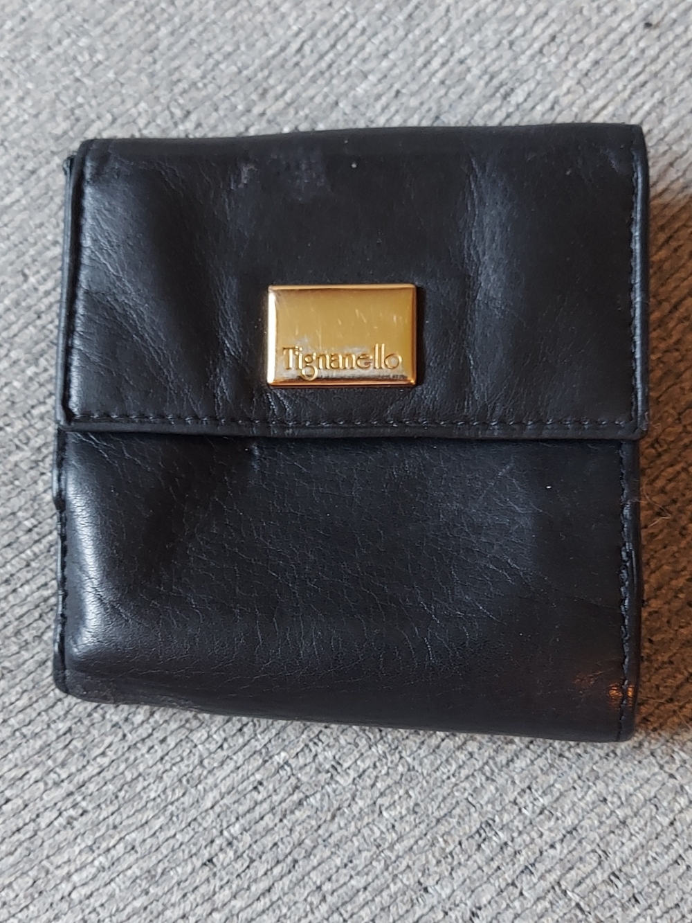Tignanello Black Leather Bi-Fold Wallet with Gold Plaque